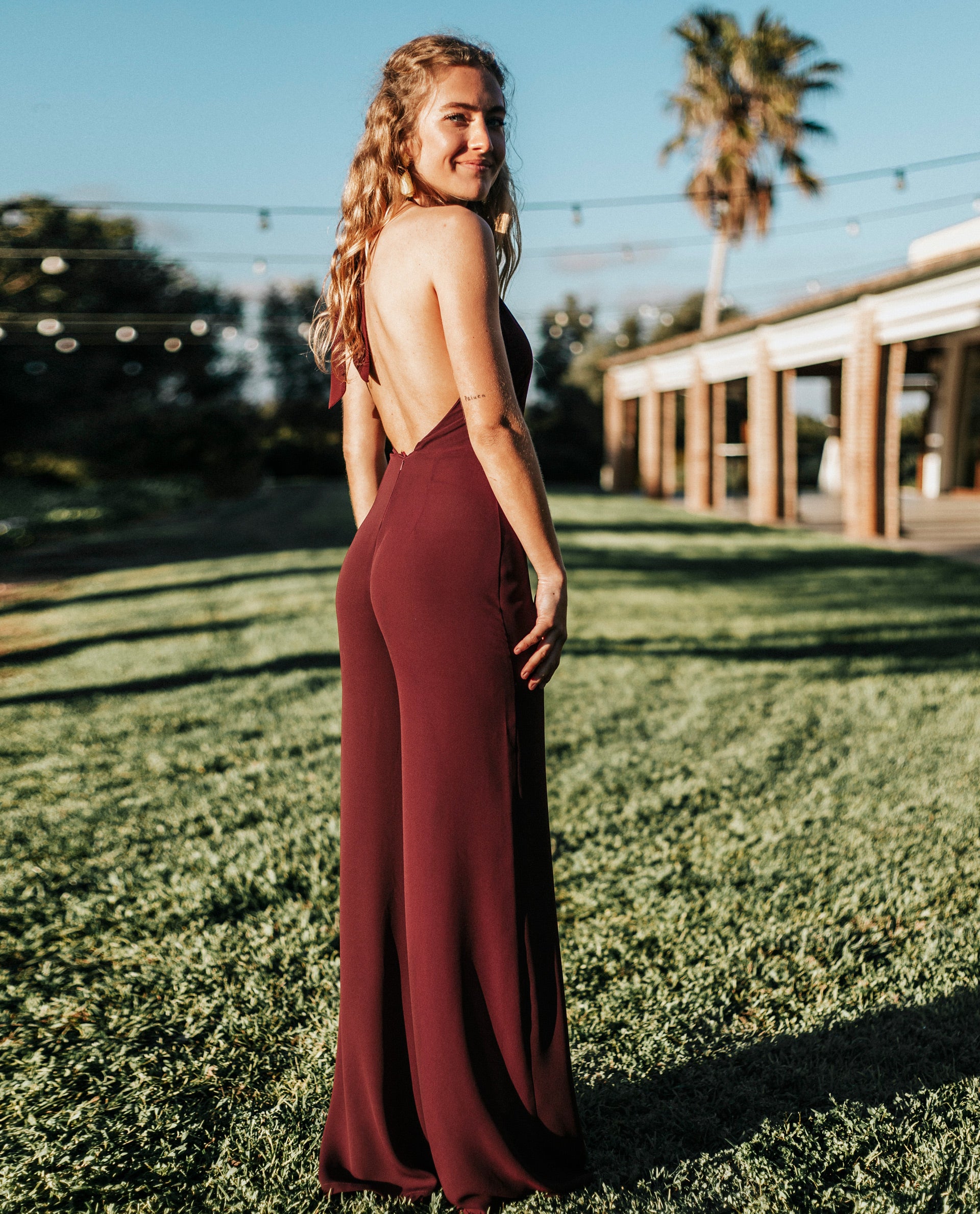 Long burgundy jumpsuit burgundy halter neckline open back THE ARE